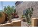 Cozy outdoor patio featuring desert landscaping and comfortable seating, perfect for relaxing and entertaining at 26062 W Potter Dr, Buckeye, AZ 85396