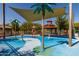 Interactive splash pad with water features, shaded seating, and recreational space, offering fun for everyone at 26062 W Potter Dr, Buckeye, AZ 85396