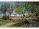Scenic walking path meandering through lush greenery and mature trees, promoting an active lifestyle at 26062 W Potter Dr, Buckeye, AZ 85396