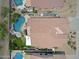 Aerial view of backyard pools and landscaping in this community with privacy walls and tile roofs at 26624 N 41St St, Cave Creek, AZ 85331