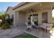 Covered back patio featuring tile flooring and stylish outdoor seating at 26624 N 41St St, Cave Creek, AZ 85331