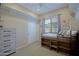 Bedroom featuring bunk beds, ample storage space, and a large window at 26624 N 41St St, Cave Creek, AZ 85331