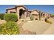 Charming single-story home showcasing desert landscaping and a welcoming front entrance at 26624 N 41St St, Cave Creek, AZ 85331