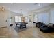 Spacious game room with pool table, stylish lighting, and plenty of natural light at 26624 N 41St St, Cave Creek, AZ 85331