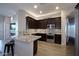 Modern kitchen with granite counters, stainless appliances, and a breakfast bar at 26624 N 41St St, Cave Creek, AZ 85331