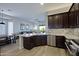 Kitchen with granite counters and stainless steel appliances at 26624 N 41St St, Cave Creek, AZ 85331