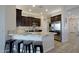 Modern kitchen with stainless steel appliances, granite countertops, and breakfast bar seating at 26624 N 41St St, Cave Creek, AZ 85331