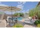 Captivating outdoor space showcasing a swimming pool, seating area, and landscaped surroundings, perfect for relaxation at 26624 N 41St St, Cave Creek, AZ 85331