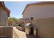 Side yard with stainless steel barbecue, storage and low-maintenance landscape at 26624 N 41St St, Cave Creek, AZ 85331