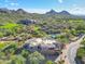Expansive desert home with pool, golf course, mountain views, and lush desert landscaping at 28990 N White Feather Ln # 185, Scottsdale, AZ 85262