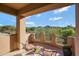 Balcony seating offers great desert views and charming wrought iron details on the railing at 28990 N White Feather Ln # 185, Scottsdale, AZ 85262