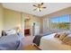 This charming bedroom features a cozy bed and a door that leads to a private bathroom at 28990 N White Feather Ln # 185, Scottsdale, AZ 85262