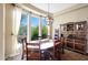 Charming dining area with a large window overlooking the outdoor landscape at 28990 N White Feather Ln # 185, Scottsdale, AZ 85262