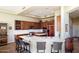 Modern kitchen with breakfast bar, stainless steel appliances, custom cabinetry, and recessed lighting at 28990 N White Feather Ln # 185, Scottsdale, AZ 85262