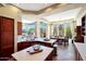 Bright kitchen with an island, sleek countertops, and a view to the dining and living areas at 28990 N White Feather Ln # 185, Scottsdale, AZ 85262