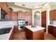 Gourmet kitchen featuring stainless steel appliances, double ovens, a gas cooktop, and an island at 28990 N White Feather Ln # 185, Scottsdale, AZ 85262