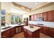 Spacious kitchen featuring an island, stainless steel appliances, and a view to the dining area at 28990 N White Feather Ln # 185, Scottsdale, AZ 85262