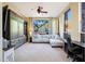 Comfortable living room with a large window, built-in storage, and a cozy sectional sofa at 28990 N White Feather Ln # 185, Scottsdale, AZ 85262