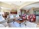 Open concept living room flowing into dining area, showcasing tile floors and elegant furnishings at 28990 N White Feather Ln # 185, Scottsdale, AZ 85262