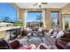 Spacious living room with fireplace, plush seating, and floor-to-ceiling windows providing ample natural light at 28990 N White Feather Ln # 185, Scottsdale, AZ 85262