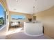 Bright loft area with comfortable seating, large windows, and a view of the surrounding landscape at 28990 N White Feather Ln # 185, Scottsdale, AZ 85262