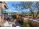 This large patio offers beautiful desert landscaping for outdoor entertaining at 28990 N White Feather Ln # 185, Scottsdale, AZ 85262