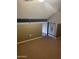 Second floor space with carpet, railing, and skylight at 30 E Brown Rd # 2065, Mesa, AZ 85201