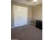 Cozy bedroom with carpet flooring, closet, and a neutral color scheme, creating a relaxing atmosphere at 30 E Brown Rd # 2065, Mesa, AZ 85201