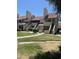 Attractive condo building featuring private entries, well-maintained landscaping, and red tile roofing at 30 E Brown Rd # 2065, Mesa, AZ 85201