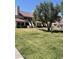 Charming townhouse complex with lush green landscaping and a beautiful red tile roof at 30 E Brown Rd # 2065, Mesa, AZ 85201