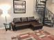 Comfortable living room area features modern furnishings, a stylish rug, and an ornate spiral staircase at 30 E Brown Rd # 2065, Mesa, AZ 85201