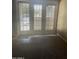 Bright living room featuring carpet flooring and a wall of windows providing natural light at 30 E Brown Rd # 2065, Mesa, AZ 85201