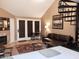 Inviting living room featuring a spiral staircase, a brown sofa, and a cozy dining area at 30 E Brown Rd # 2065, Mesa, AZ 85201