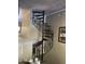 Unique black spiral staircase with decorative metalwork, adding a touch of elegance to the home's interior at 30 E Brown Rd # 2065, Mesa, AZ 85201
