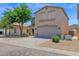 Charming two-story home with a spacious driveway, low-maintenance desert landscaping, and a two-car garage at 30032 N Desert Willow Blvd, San Tan Valley, AZ 85143