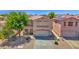 Lovely two-story home with a tile roof, two-car garage, and low-maintenance desert landscaping at 30032 N Desert Willow Blvd, San Tan Valley, AZ 85143