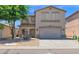 Attractive two-story home with a two-car garage, neutral stucco exterior, and desert landscaping at 30032 N Desert Willow Blvd, San Tan Valley, AZ 85143
