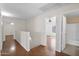 Upstairs hallway with wood floors leads to bedrooms and bathroom at 30032 N Desert Willow Blvd, San Tan Valley, AZ 85143