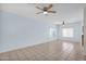 Spacious living room with ceiling fans and tile floors, bathed in natural light at 30032 N Desert Willow Blvd, San Tan Valley, AZ 85143