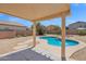 Backyard features a private pool and a covered patio great for relaxing at 30032 N Desert Willow Blvd, San Tan Valley, AZ 85143