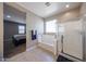 Bathroom featuring a separate shower and tub, a blue towel, and neutral walls at 30560 W Weldon Ave, Buckeye, AZ 85396