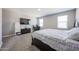 Spacious bedroom featuring neutral walls, carpet floors, and a dark wood bed frame at 30560 W Weldon Ave, Buckeye, AZ 85396