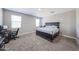Relaxing bedroom retreat with neutral tones, plush carpeting, and a comfortable bed at 30560 W Weldon Ave, Buckeye, AZ 85396