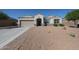 Charming single-story home featuring a low-maintenance desert landscape and a two-car garage at 30560 W Weldon Ave, Buckeye, AZ 85396