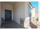 Cozy front porch features stone accents and a welcoming entrance with a decorative wreath at 30560 W Weldon Ave, Buckeye, AZ 85396
