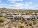Sprawling community featuring solar panels, sparkling pools, and desert landscape at 31156 N 137Th Ln, Peoria, AZ 85383