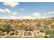 Backyard with a water feature and desert landscaping with mountain views in the distance at 31156 N 137Th Ln, Peoria, AZ 85383