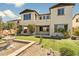 Beautiful backyard with synthetic grass, desert landscaping, and an outdoor patio at 31156 N 137Th Ln, Peoria, AZ 85383