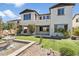 Beautiful backyard showcasing artificial grass, desert landscaping, and a charming stone fountain at 31156 N 137Th Ln, Peoria, AZ 85383