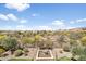 Scenic backyard view showcases desert landscaping and distant mountains, offering a serene setting at 31156 N 137Th Ln, Peoria, AZ 85383
